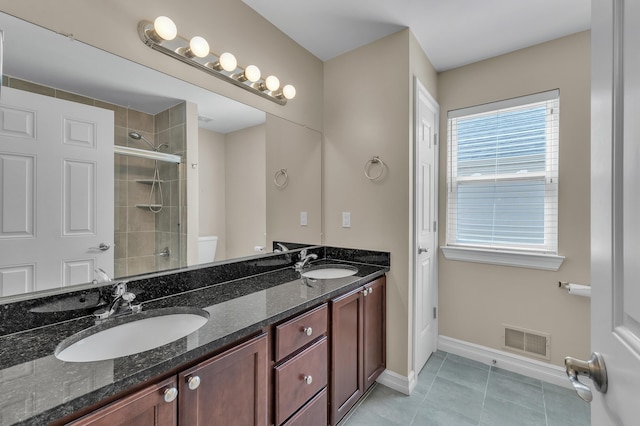 50501 Elmwood Ct, Plymouth, MI 48170 - bathroom featuring double vanity, tile patterned flooring, and tiled shower