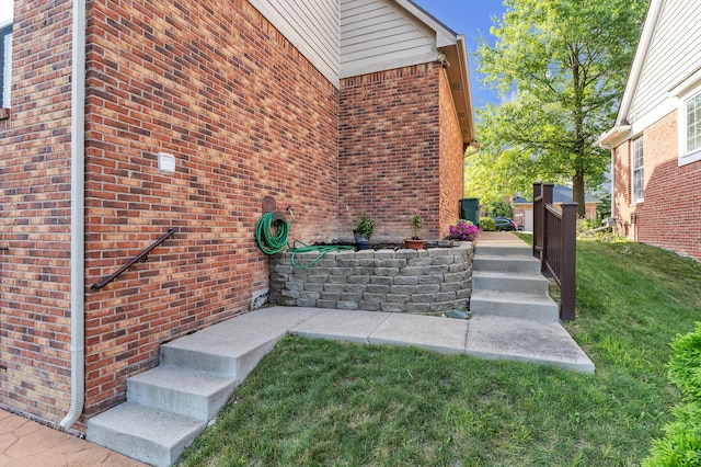 50501 Elmwood Ct, Plymouth, MI 48170 - doorway to property with brick siding and a yard