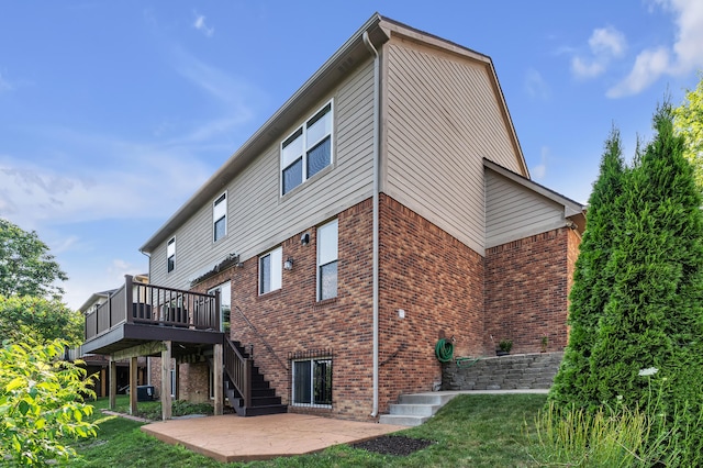50501 Elmwood Ct, Plymouth, MI 48170 - rear view of house featuring a patio area, stairs, brick siding, a deck, and a yard
