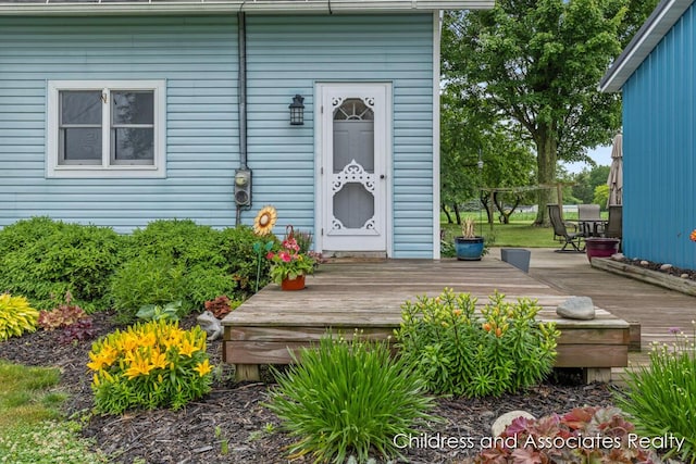 13872 Hastings Rd, Freeport, MI 49325 - property entrance with a deck