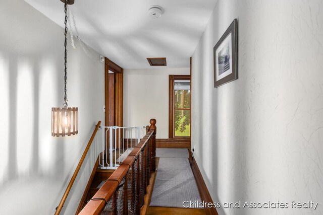 13872 Hastings Rd, Freeport, MI 49325 - hallway featuring an upstairs landing and attic access