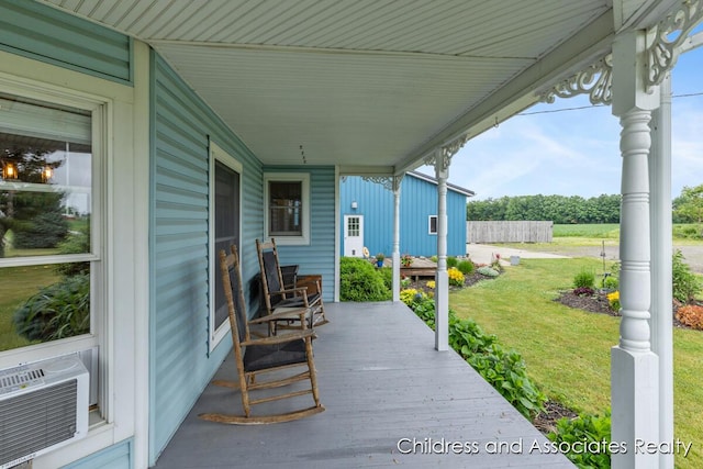 13872 Hastings Rd, Freeport, MI 49325 - covered porch featuring a yard