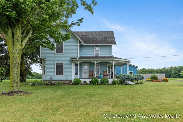 13872 Hastings Rd, Freeport, MI 49325 - view of front facade featuring a porch, a front lawn, and a shingled roof