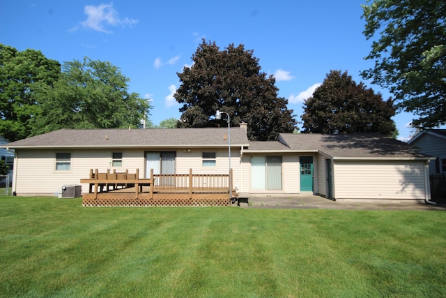 6426 Westchester St, Portage, MI 49024 - rear view of property with a yard, an attached garage, and a deck