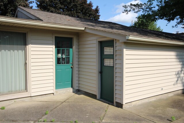 6426 Westchester St, Portage, MI 49024 - property entrance featuring roof with shingles