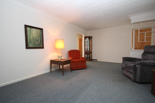 6426 Westchester St, Portage, MI 49024 - carpeted living area with baseboards and ornamental molding