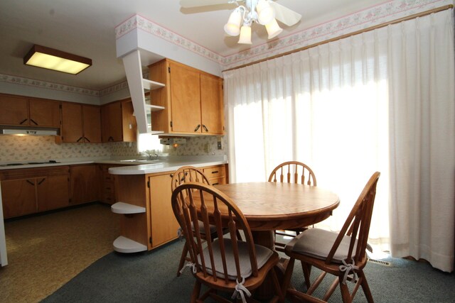 6426 Westchester St, Portage, MI 49024 - dining area featuring dark colored carpet and a ceiling fan