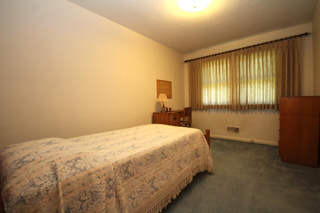 6426 Westchester St, Portage, MI 49024 - carpeted bedroom featuring lofted ceiling and baseboards