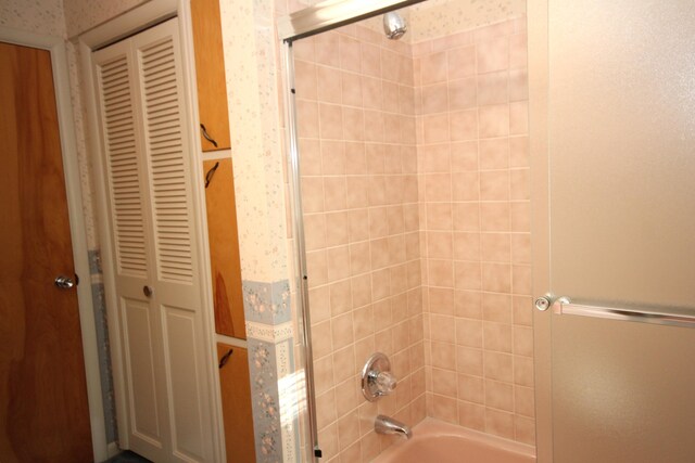 6426 Westchester St, Portage, MI 49024 - bathroom featuring  shower combination, a closet, and wallpapered walls
