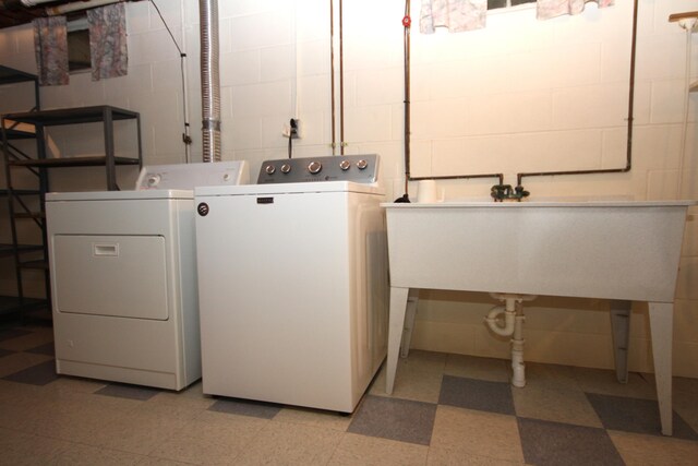 6426 Westchester St, Portage, MI 49024 - laundry room with light flooring, washing machine and dryer, and concrete block wall