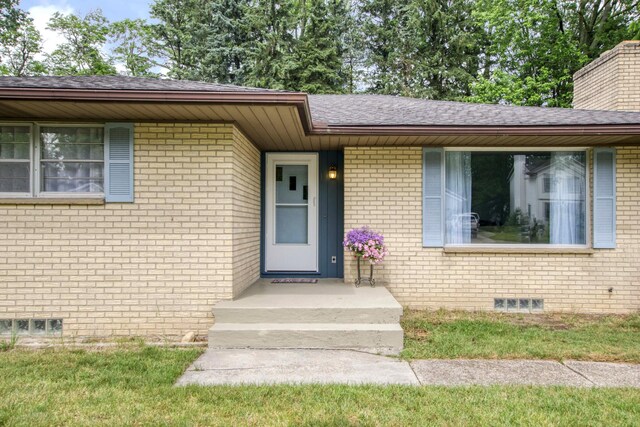 1736 Glenvale Dr SW, Wyoming, MI 49519 - entrance to property featuring brick siding and a shingled roof
