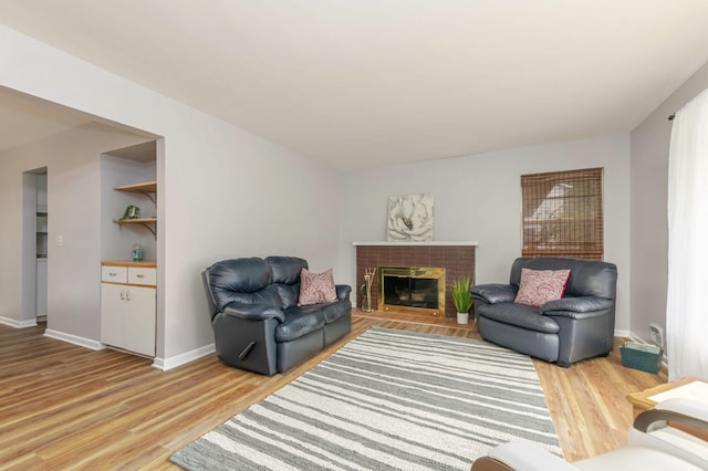1736 Glenvale Dr SW, Wyoming, MI 49519 - living area featuring light wood-style floors and a fireplace