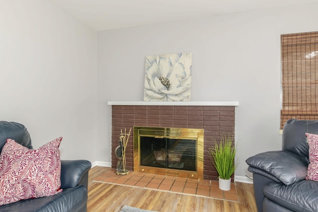 1736 Glenvale Dr SW, Wyoming, MI 49519 - living room featuring a brick fireplace and wood finished floors