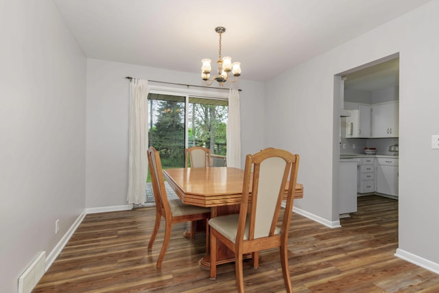 1736 Glenvale Dr SW, Wyoming, MI 49519 - dining space with a chandelier and wood finished floors