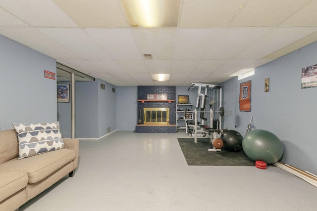 1736 Glenvale Dr SW, Wyoming, MI 49519 - workout area featuring a paneled ceiling and a fireplace