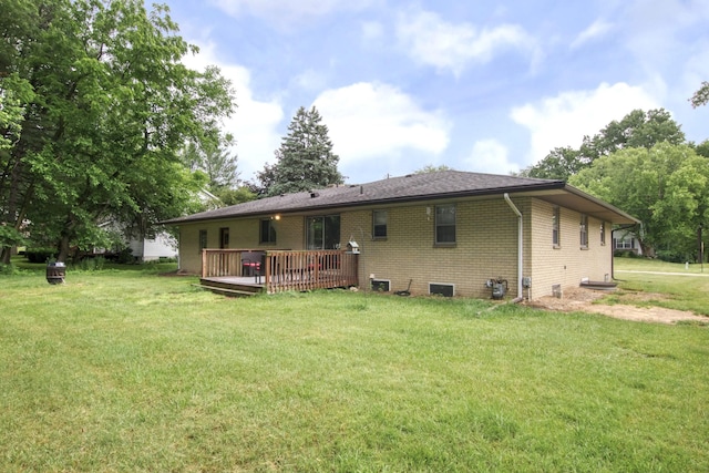 1736 Glenvale Dr SW, Wyoming, MI 49519 - rear view of house featuring brick siding, a wooden deck, and a yard