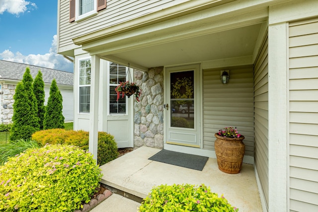 7149 Indian Wells Dr, Ypsilanti, MI 48197 - doorway to property with stone siding and covered porch