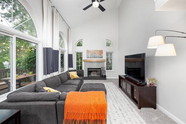 7149 Indian Wells Dr, Ypsilanti, MI 48197 - living room with a brick fireplace, high vaulted ceiling, ceiling fan, and carpet flooring