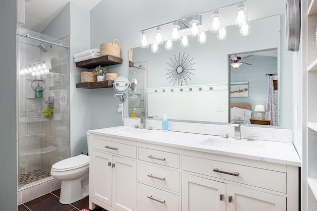 7149 Indian Wells Dr, Ypsilanti, MI 48197 - ensuite bathroom featuring a ceiling fan, a stall shower, double vanity, and tile patterned flooring