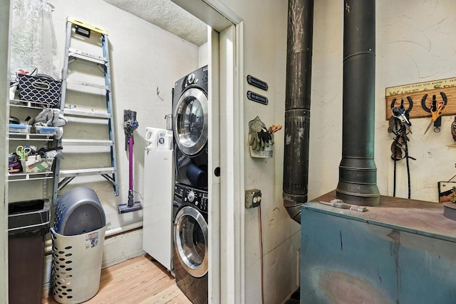 8454 Stickles Rd, Three Oaks, MI 49128 - washroom with stacked washer / drying machine and wood finished floors