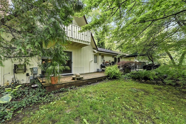 8454 Stickles Rd, Three Oaks, MI 49128 - view of green lawn featuring a balcony and a deck