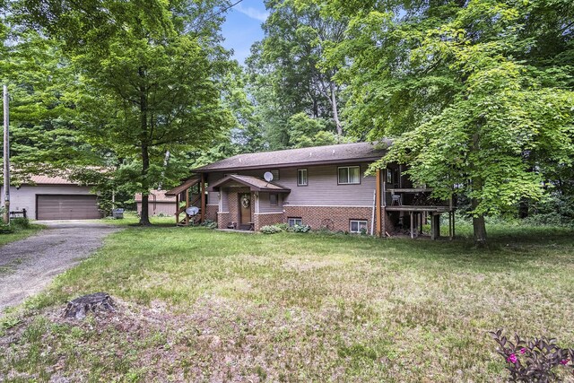 4424 Teal Ln, Newaygo, MI 49337 - view of front of house featuring an outdoor structure, a front yard, and a detached garage