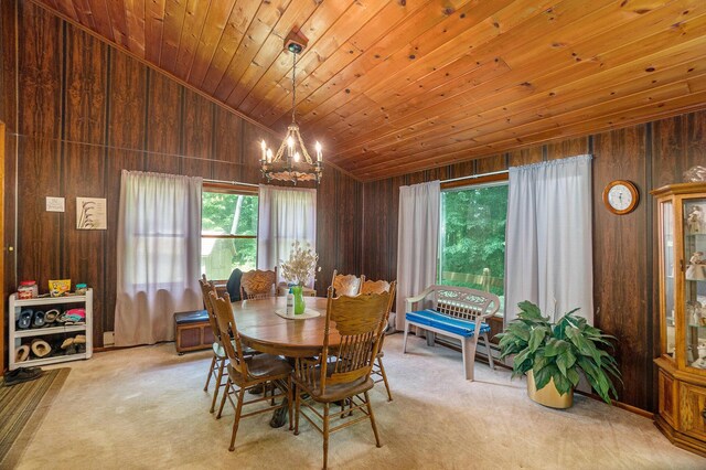 4424 Teal Ln, Newaygo, MI 49337 - dining space with carpet, wood walls, a chandelier, lofted ceiling, and wood ceiling