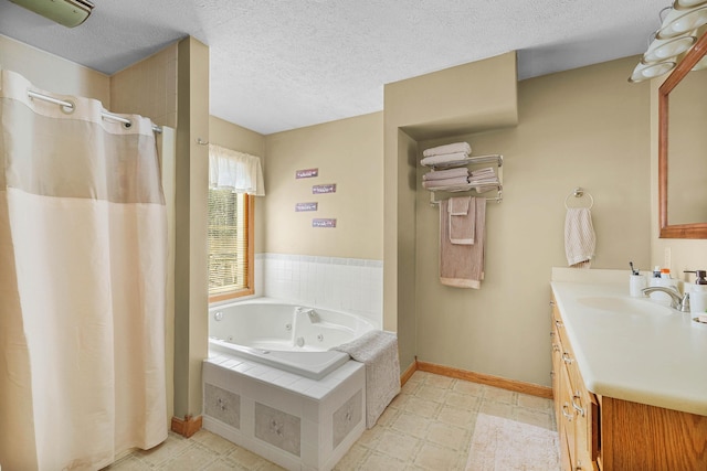 4792 Forest Vale Dr, Pierson, MI 49339 - bathroom with a tub with jets, vanity, a shower with shower curtain, a textured ceiling, and tile patterned floors