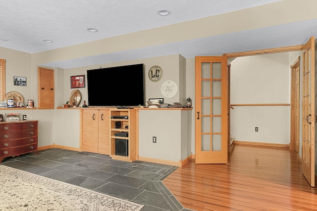 4792 Forest Vale Dr, Pierson, MI 49339 - living area featuring a textured ceiling, dark wood-style floors, and recessed lighting