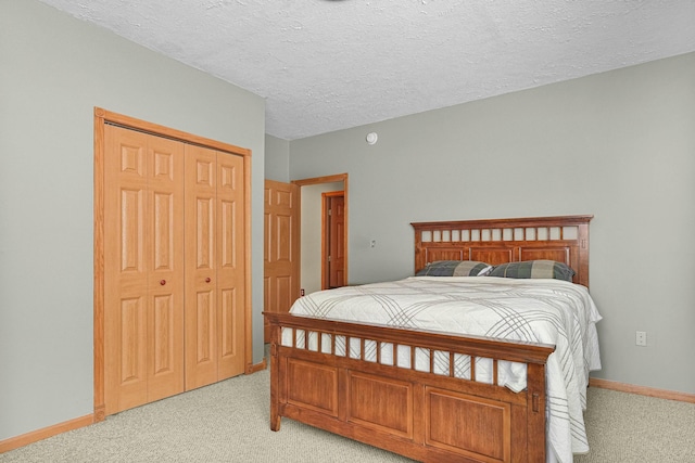4792 Forest Vale Dr, Pierson, MI 49339 - bedroom with light colored carpet, a closet, and a textured ceiling