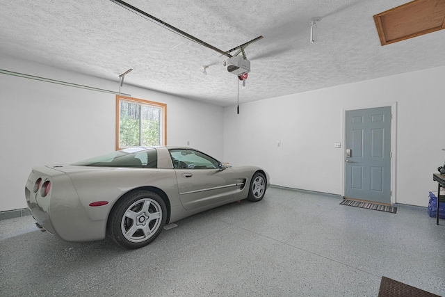 4792 Forest Vale Dr, Pierson, MI 49339 - garage featuring a garage door opener