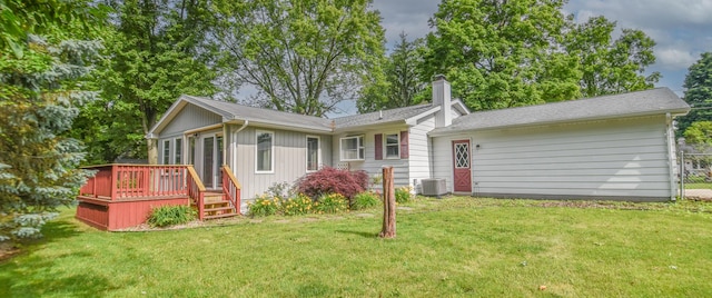 72 Branch Ave, Coldwater, MI 49036 - rear view of property featuring a deck, a lawn, a chimney, and board and batten siding