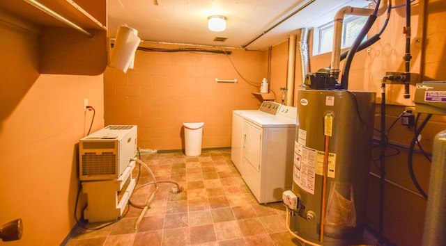 72 Branch Ave, Coldwater, MI 49036 - washroom featuring independent washer and dryer, gas water heater, and concrete block wall