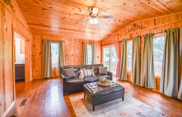 72 Branch Ave, Coldwater, MI 49036 - living area with vaulted ceiling, wood walls, ceiling fan, wood ceiling, and hardwood / wood-style flooring