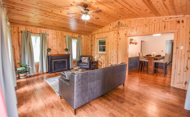 72 Branch Ave, Coldwater, MI 49036 - living area with vaulted ceiling, wood walls, wood ceiling, a ceiling fan, and wood finished floors