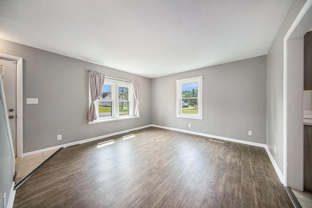 1836 W Argus Ct, Jackson, MI 49203 - unfurnished room with wood finished floors and baseboards