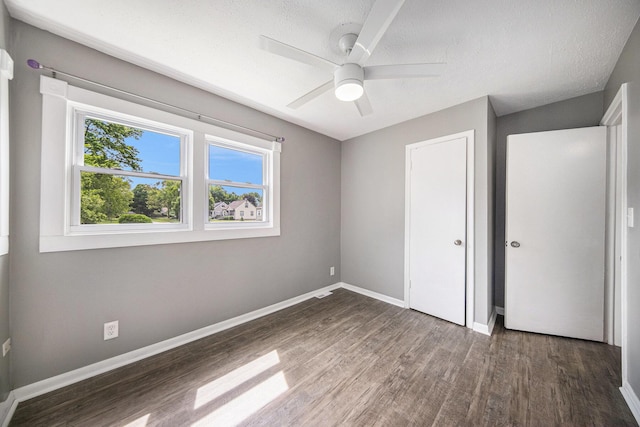1836 W Argus Ct, Jackson, MI 49203 - unfurnished bedroom with wood finished floors, ceiling fan, and a closet