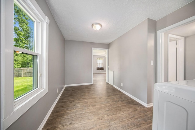 1836 W Argus Ct, Jackson, MI 49203 - unfurnished room with a textured ceiling, wood finished floors, and independent washer and dryer
