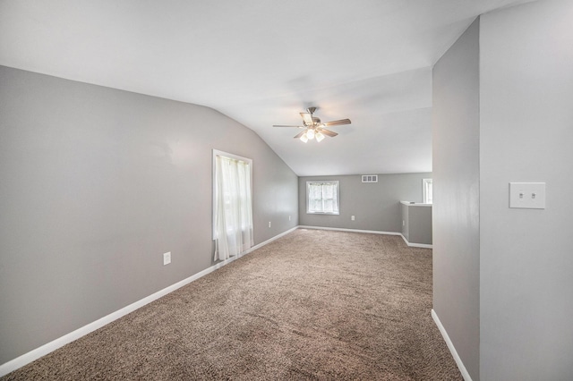 1836 W Argus Ct, Jackson, MI 49203 - empty room featuring ceiling fan, vaulted ceiling, and carpet