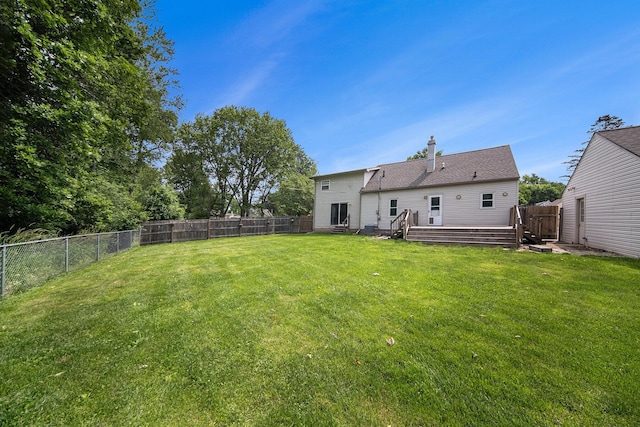 1836 W Argus Ct, Jackson, MI 49203 - back of house featuring a wooden deck and a fenced backyard