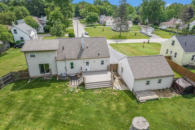 1836 W Argus Ct, Jackson, MI 49203 - rear view of property with a residential view, a wooden deck, a fenced backyard, and entry steps