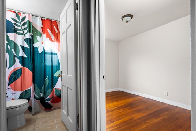 2834 Pittsfield Blvd, Ann Arbor, MI 48104 - bathroom featuring hardwood / wood-style floors and curtained shower