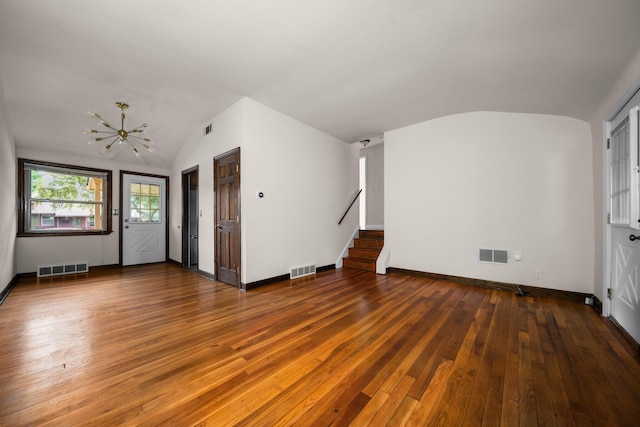 2834 Pittsfield Blvd, Ann Arbor, MI 48104 - unfurnished living room with lofted ceiling, stairway, hardwood / wood-style floors, and a chandelier