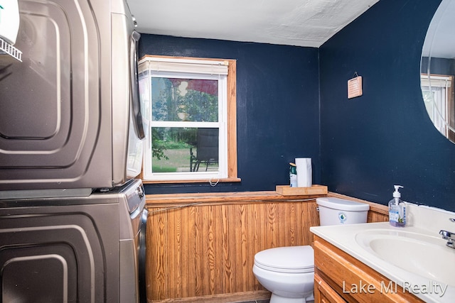 4128 Michael Ave SW, Wyoming, MI 49509 - bathroom with stacked washing machine and dryer and vanity