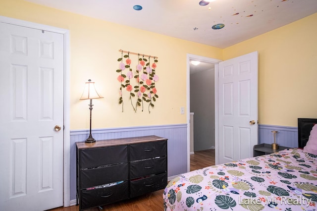 4128 Michael Ave SW, Wyoming, MI 49509 - bedroom with a wainscoted wall and wood finished floors