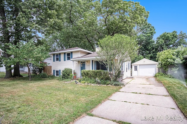 4128 Michael Ave SW, Wyoming, MI 49509 - tri-level home with a front yard, an outdoor structure, a detached garage, and concrete driveway