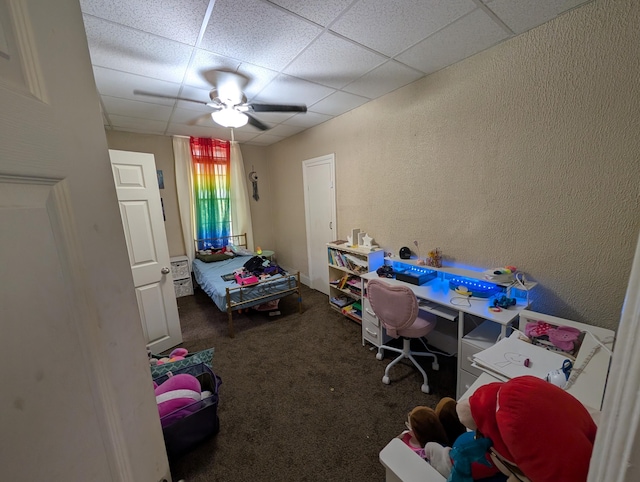 1236 Fulton Ave, Grand Haven, MI 49417 - carpeted bedroom featuring a drop ceiling, a textured wall, and ceiling fan