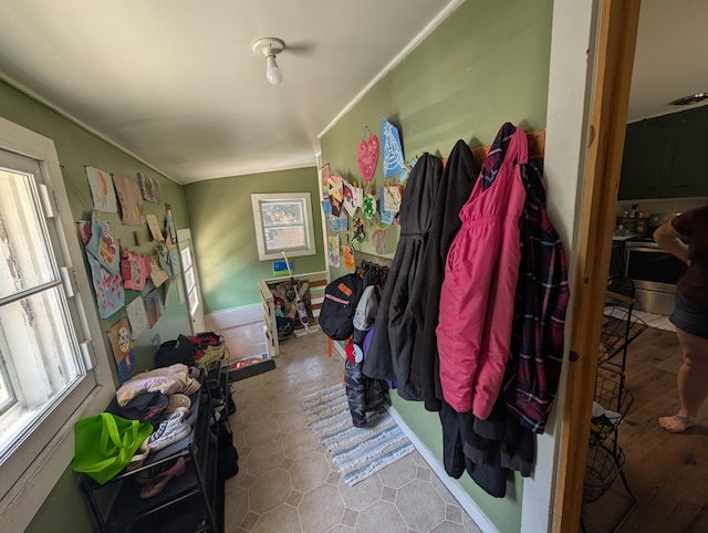 1236 Fulton Ave, Grand Haven, MI 49417 - mudroom featuring healthy amount of natural light and ornamental molding