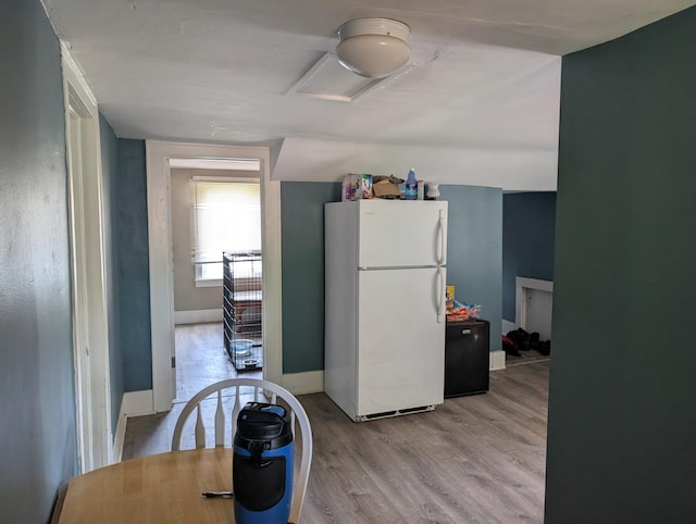 1236 Fulton Ave, Grand Haven, MI 49417 - kitchen featuring freestanding refrigerator and wood finished floors