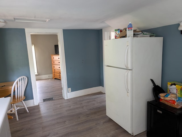 1236 Fulton Ave, Grand Haven, MI 49417 - kitchen featuring freestanding refrigerator, wood finished floors, and refrigerator